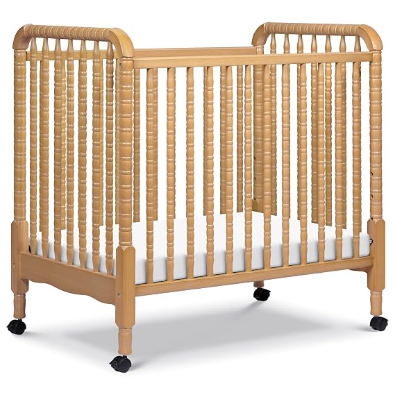 Davinci Jenny Lind 3-in-1 Convertible Mini Crib in Honey, Removable Wheels, Greenguard Gold Certified | GREENGUARD Certified Mini Crib w/ Removable Wheels, Converts to Toddler Bed & Daybed w/ 4 Adjustable Mattress Heights